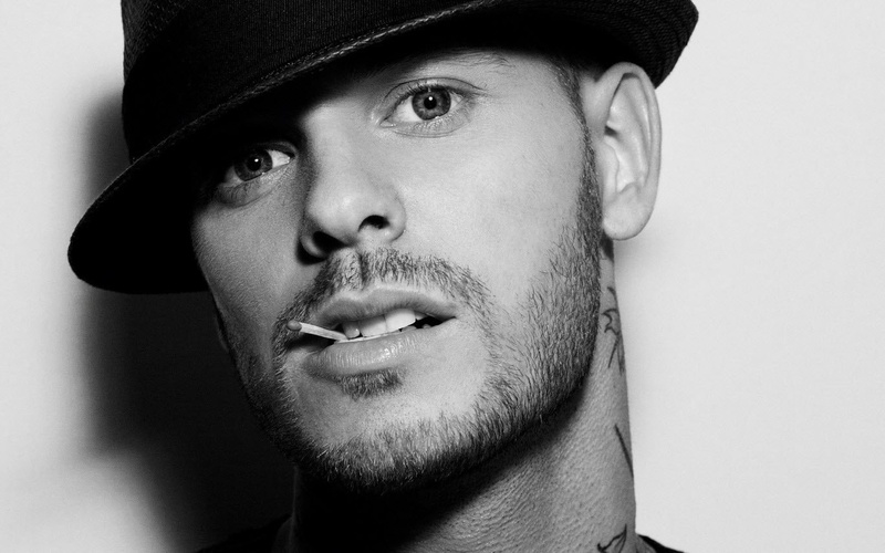indoors, 720P, facial hair, matches, one person, body part, young men, looking at camera, adult, hat, close-up, cap, studio shot, headshot, beard, human face
