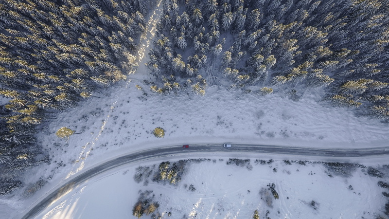 mountain, cold temperature, nature, vehicles, speed, top, snow, white, aerial, water, near, road, high angle view, tree, beauty in nature, travel, wood