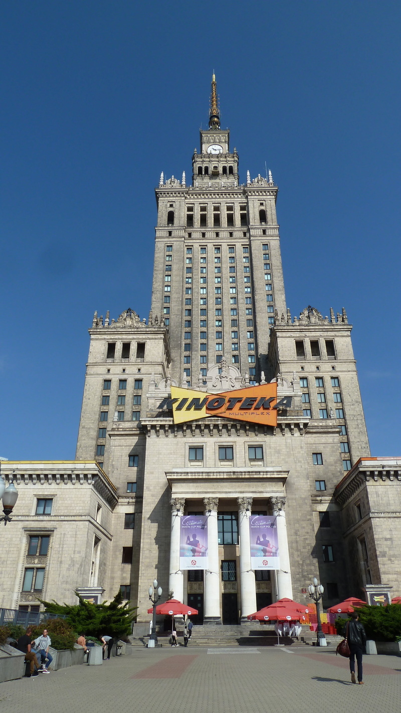 incidental people, stalin, low angle view, tourism, day, palace of culture and science, clear sky, tower, group of people, blue, tall - high, building