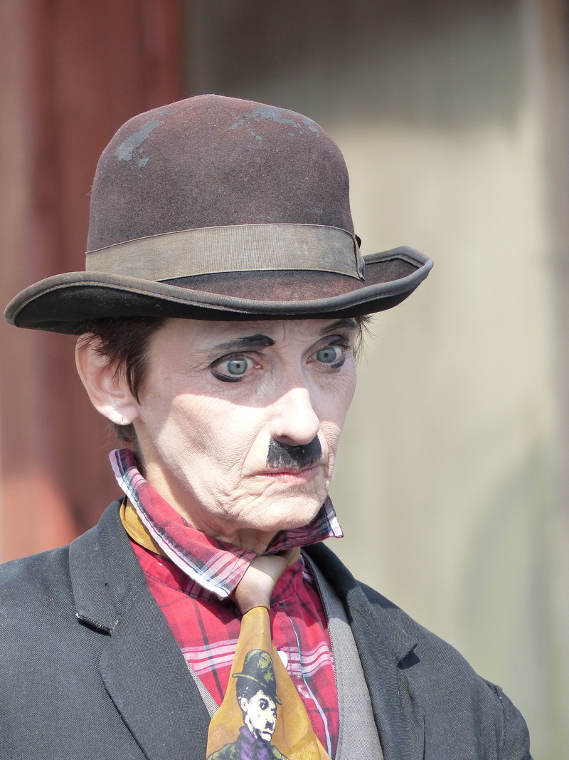 day, focus on foreground, front view, charlie, costume, 4K, portrait, copy, close-up, face, charlie chaplin, tie, suit, adult, headshot, expression, sad