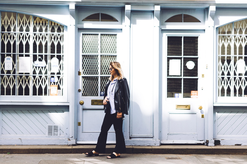 hairstyle, door, window, real people, adult, beautiful woman, fashion, store, jacket, hair, outdoors, women, sidewalk, white, casual clothing, built structure