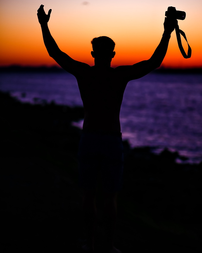 relaxation, person, limb, outdoors, beauty in nature, arms raised, religion, summer, sun, human limb, man, vacations, dslr, back Lit, hands, camera, one Person