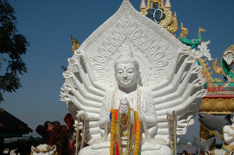 creativity, low angle view, sculpture, white, demon - fictional character, spirituality, place of worship, ornate, idol, belief, art and craft, sky, no people