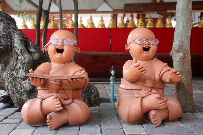 asia, doll, retail display, no people, outdoors, sing, toy, statues, religion, still life, cultures, yoga, art and craft, finger man, sound, glasses, craft
