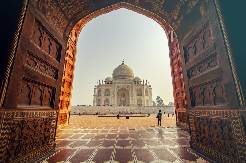 people, history, building exterior, travel, incidental people, tourism, arch, monument, ancient civilization, travel destinations, mahal, sky, dome, architecture