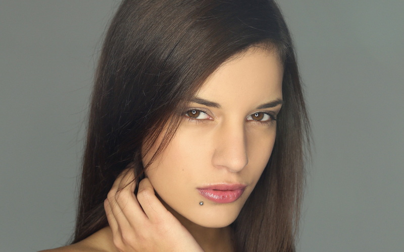 close-up, piercing, one person, holding, studio shot, hair, 2K, young women, teenager, brunette, woman, hairstyle, fashion, young adult, women, pink, lipstick