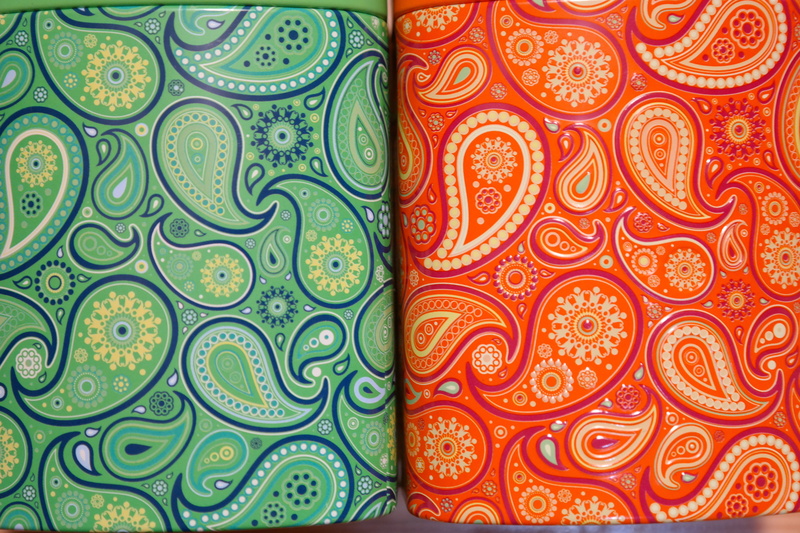 metal cans, floral pattern, still life, color, repetition, art and craft, side by side, colorful, high angle view, no people, creativity, variation, green color