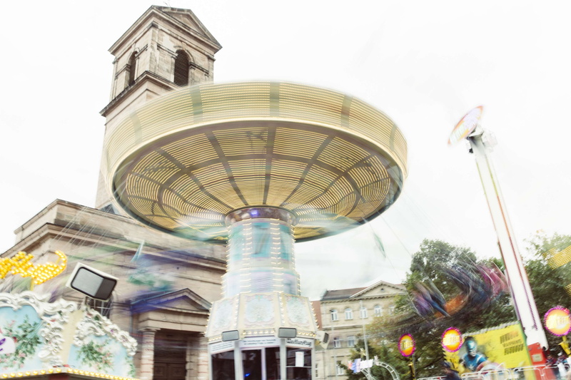 carnival, clock, fun, building exterior, day, lights, travel, plant, amusement park, tall - high, outdoors, sky, built structure, building, carrousel, colored