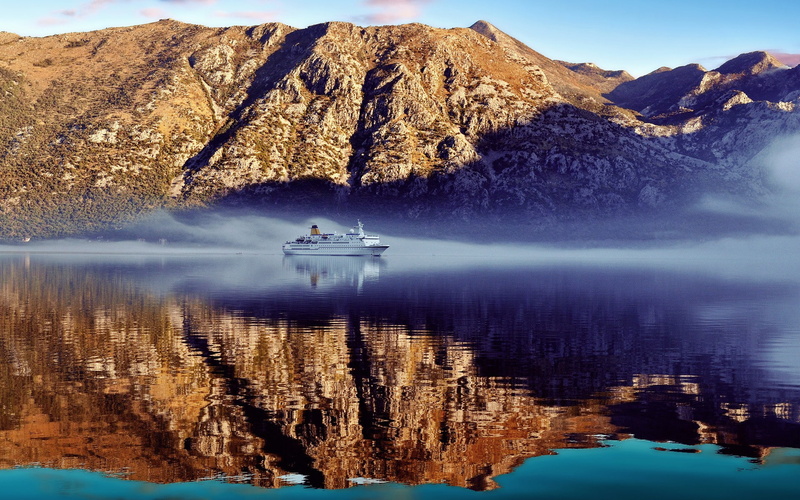 beauty in nature, mountain range, tranquil scene, symmetry, non-urban scene, ship, lake, outdoors, landscape, no people, scenics - nature, tranquility