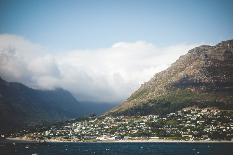 water, ocean, outdoors, built structure, townscape, mountain range, no people, building exterior, mountain, day, beauty in nature, cape town, tree, scenics - nature