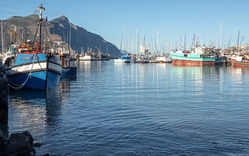 marina, yacht, mountain, sunlight, ship, port, outdoors, blue, anchored, water, no people, harbor, nature, moored, day, nautical, sailboat, mast, sail