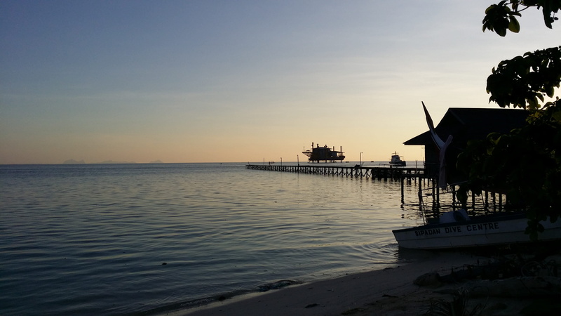 jetty, water, silhouette, sunset, reflection, sipadan, built structure, tranquility, beauty in nature, scenics - nature, architecture, nature, sky, tranquil scene