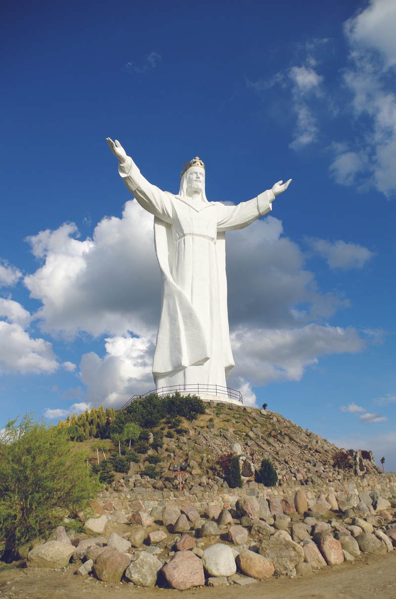 travel, świebodzin, a statue of jesus, spirituality, human arm, cross, sky, monument, solid, nature, mountain, architecture, jesus christ, low angle view