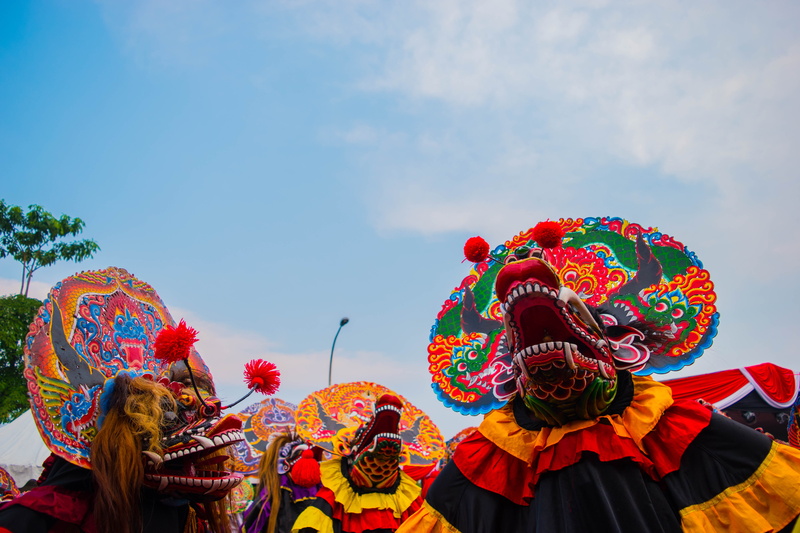 focus on foreground, creativity, traditional dancing, culture, outdoors, dancing, animal representation, 5K, festival, sky, leisure activity, indonesia
