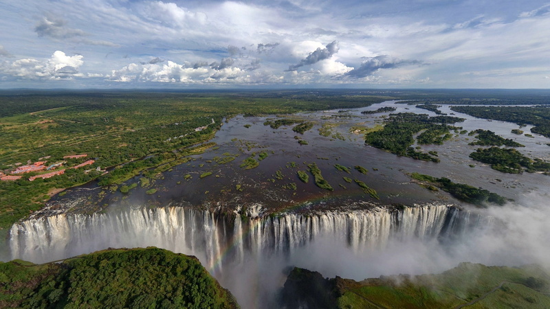 tourism, flowing, environment, water, cloud - sky, motion, landscape, sky, land, beauty in nature, outdoors, lake waterfall trees landscape zambezi river victoria falls