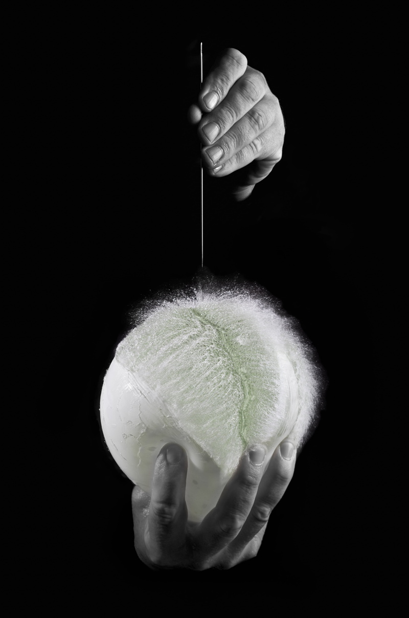 food, black background, human hand, human body part, water balloon, body part, food and drink, balloon, one man only, people, needle, adult, indoors, holding
