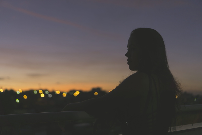 contemplation, sunset, night, young women, city, light, built structure, real people, girl, canon, side view, nature, orange color, sun, focus on foreground