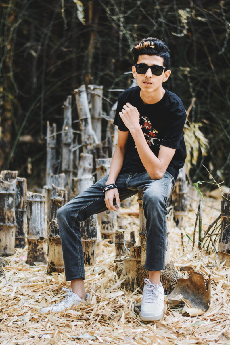 black, lifestyles, accessories, plant, real people, glasses, nature, young adult, person, dark, potrait, land, one person, full length, sunglasses, hairstyle