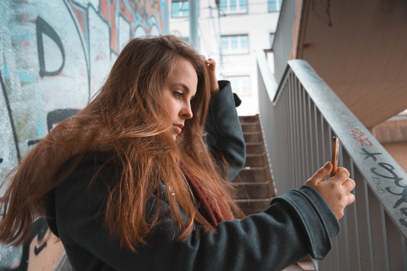 real people, brown hair, modern, waist up, young adult, human hair, fade, photoshoot, faded, 5K, style, women, contemplation, warm clothing, city, day