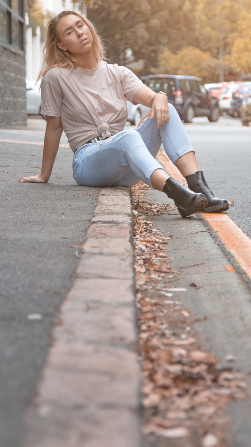 leisure activity, beautiful woman, surface level, full length, hairstyle, lifestyles, 5K, street, young adult, qld, front view, sitting, casual clothing