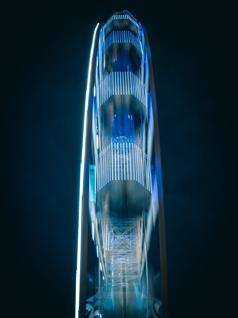office Building, glass - Material, ferris wheel, finance, festival, blur, construction Industry, steel, business, sky, amusement ride, amusement park, carnival