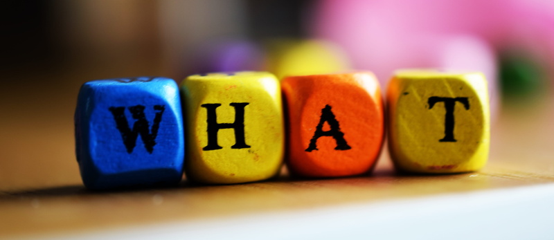 letters, multi colored, in a row, text, selective focus, what, wooden, group of objects, letter, cubes, blue, four, four objects, focus on foreground, indoors