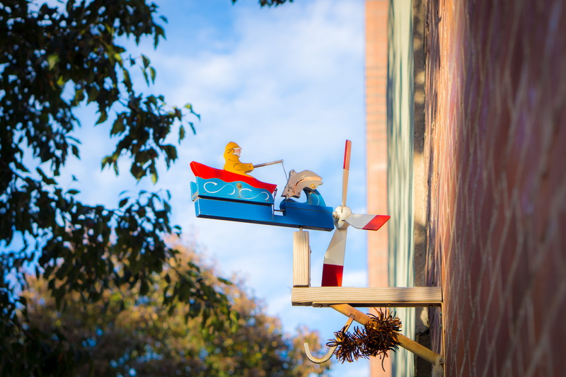 fishing, sky, united states, urban, outdoors, architecture, unexpected, city, human representation, day, whirly gig, yellow, representation, cloud - sky