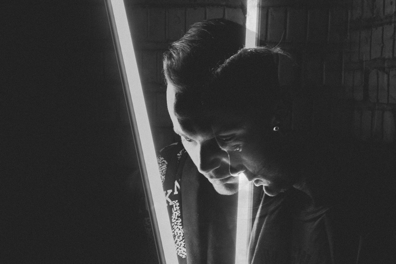 human, young adult, depression - sadness, real people, hairstyle, grayscale, head, musician, face, window, teenager, mid, piano, home interior, lifestyles