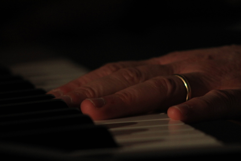 selective focus, crystal, computer, one person, electronics, leisure activities, piano key, human hand, hardware, ring, musical equipment, music, black background