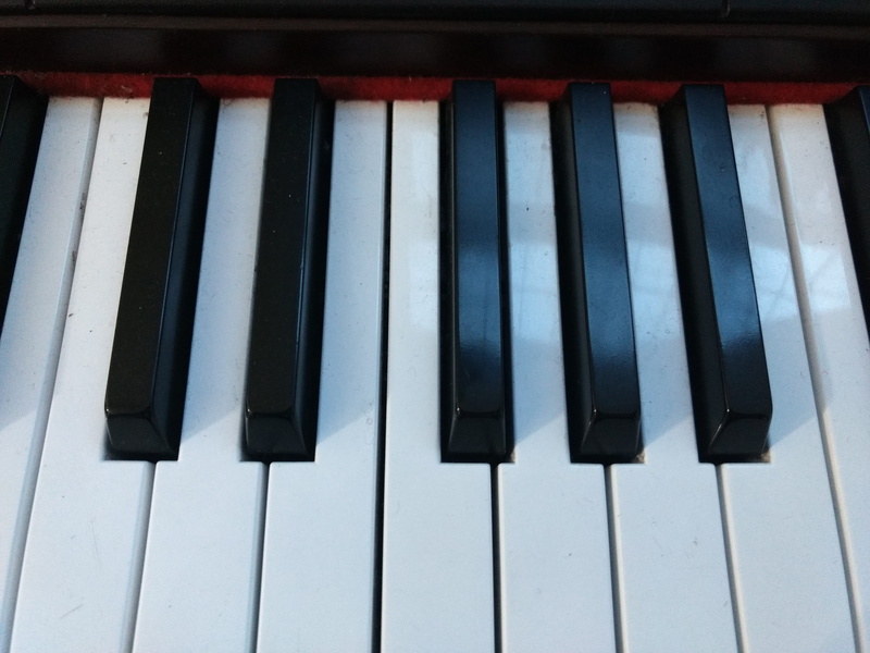 grand piano, upright piano, tie, no people, old, accessories, maroon, musical equipment, electronics, stopwatch, white color, accessory, piano key, striped