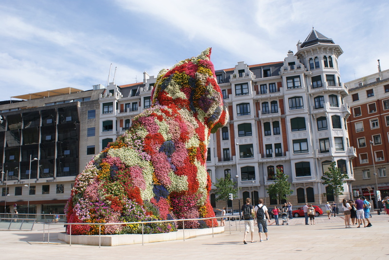 4K, city, people, cloud - sky, lifestyles, crowd, building, built structure, real people, guggenheim, building exterior, tree, group of people, sculpture