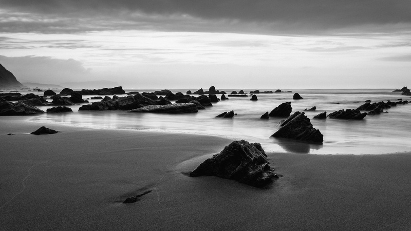 spain, scenics - nature, ocean, outdoors, tranquil scene, barrika, horizon over water, shore, rocks, no people, sand, dock, pier, land, solid, sea, grayscale