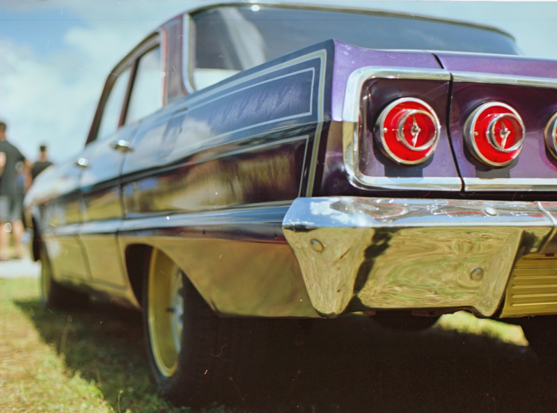 taillight, wheeled vehicle, obsolete, s, day, outdoors, road, field, focus, classic, auto, windshield, nature, travel, close-up, old, stationary, muscle