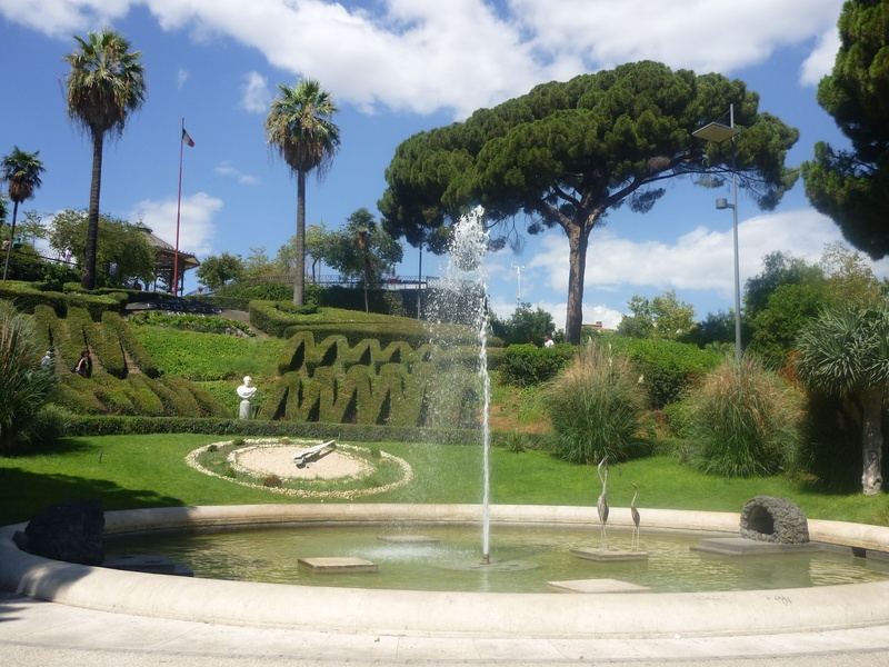 growth, palm tree, water, cloud - sky, catania, plant, grass, park, day, green color, garden, sky, tropical climate, nature, sicily, built structure, italy