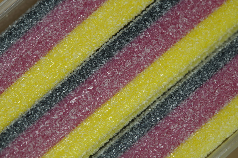 temptation, black red gold, fanartikel, in a row, high angle view, no people, yellow, textile, gummibärchen, multi colored, close, texture, food, flag