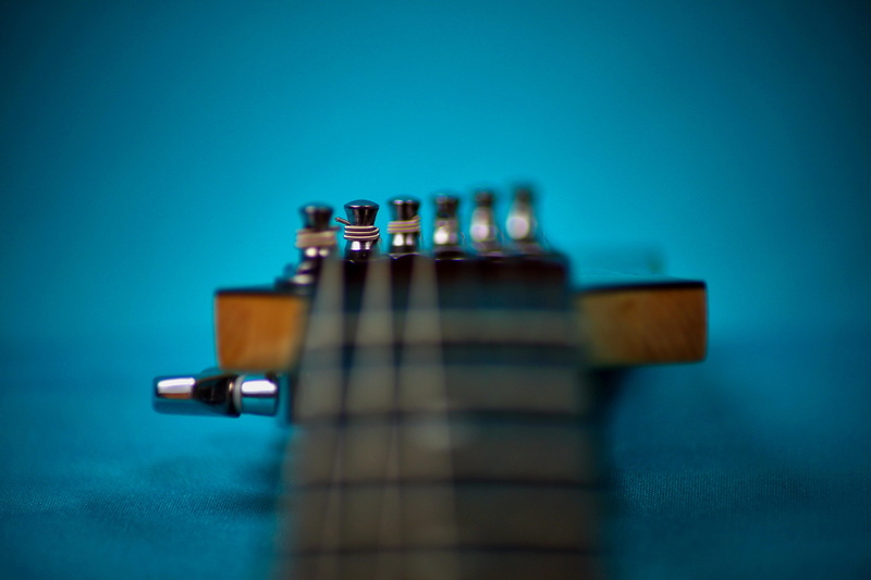metal, ibanez, rg series, wood - material, studio shot, no people, blue, guitar, creativity, electric guitar, toy, table, colored background, selective focus