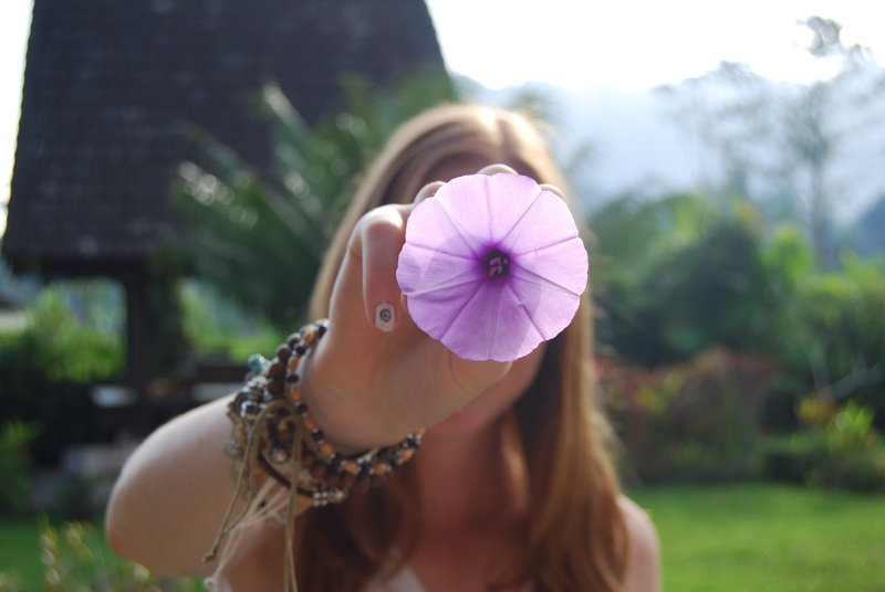 purple, clothing, lifestyles, leisure activity, outdoors, 4K, long hair, headshot, focus on foreground, holding, women, front view, hair, petaled, woman