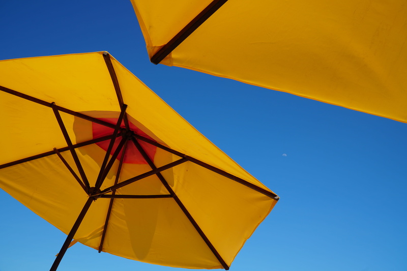 angle, outdoors, 5K, yellow, multi colored, beach, no people, view, vibrant color, blue, umbrellas, shade, parasol, low, clear sky, day, sky, close-up