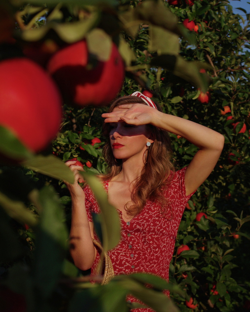 standing, hairstyle, tree, casual clothing, adult, red, portrait, human, citrus fruit, flower, women, apple, grapefruit, nature, apples, front view, red apples