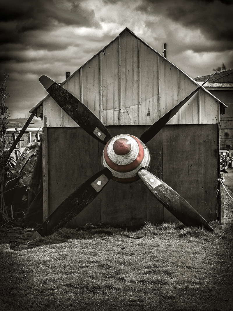 gear, water tower, the past, pump, land, cloud - sky, grass, wheel, day, building exterior, gas pump, housing, no people, screw, field, spider web, metal