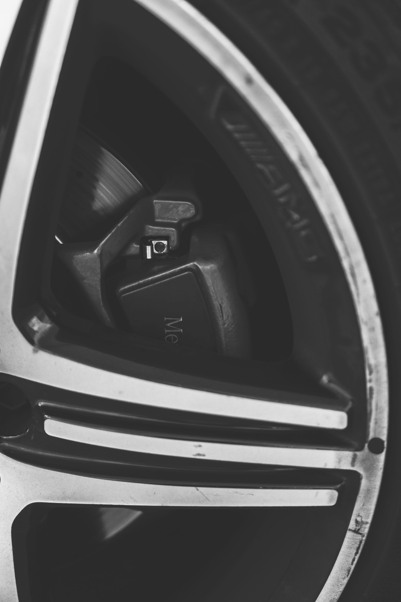 camera lens, clothing, close-up, helmet, machine, indoors, land vehicle, photographic equipment, vehicle interior, communication, car trunk, transportation