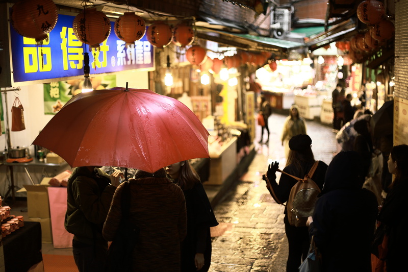 bazaar, overcoat, market, protection, canopy, transportation, building, rear view, pedestrian, real people, city, red, umbrella, men, town, walking, retail