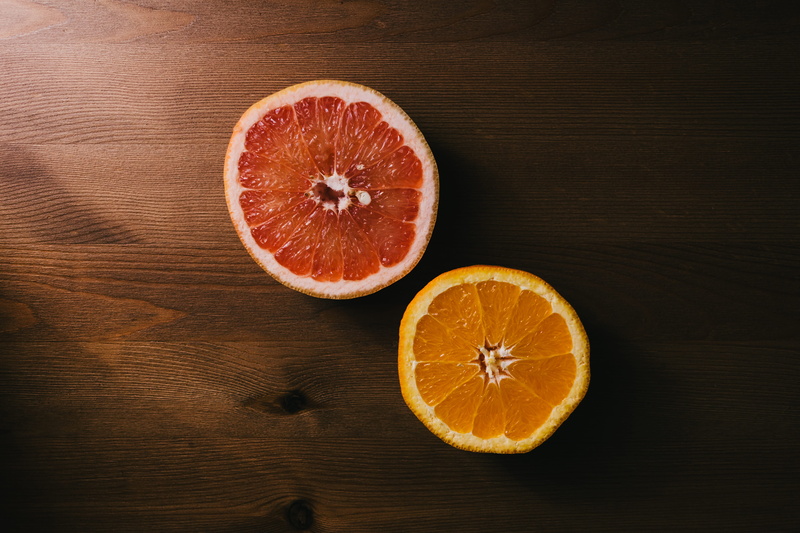 wooden, halves, slice, orange, fruits, clense, taste, healthy eating, red, round, no people, freshness, orange color, wood grain, seed, sour taste, ripe