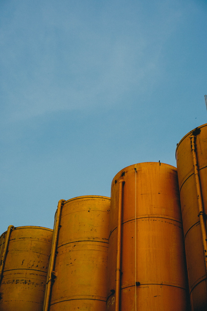 train, 5K, refinery, storage tank, building exterior, yellow, storage compartment, rust, silos, transportation, container, brewery, vehicle, barrel, banister
