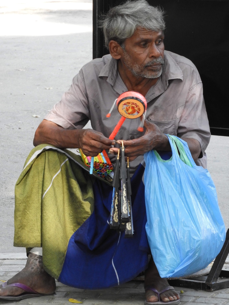 blade, lifestyles, holding, festival, males, day, outdoors, real people, sphere, men, crowd, sleeve, letter opener, leisure activity, mature men, sri lanka