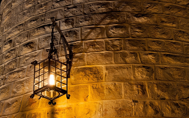 stone material, the past, no people, pattern, lantern, electric lamp, Wall lamp, history, solid, built structure, building, stone wall, wall - building feature