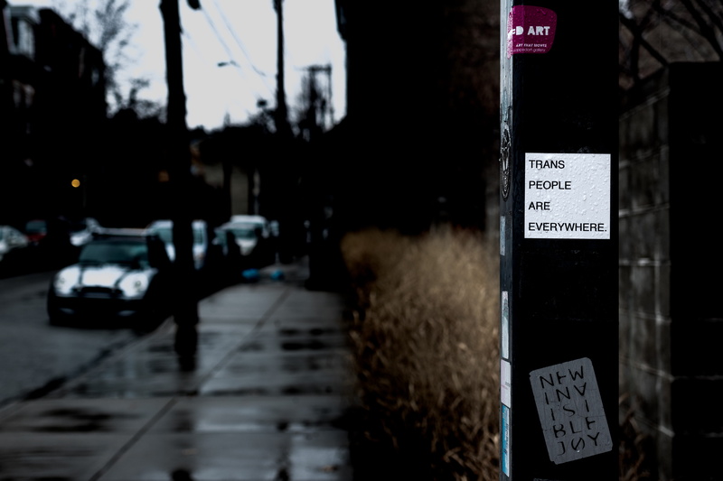 symbol, white, mode of transportation, script, tarmac, apparel, label, car, overcoat, sign, paper, western script, close, non-western script, motor vehicle