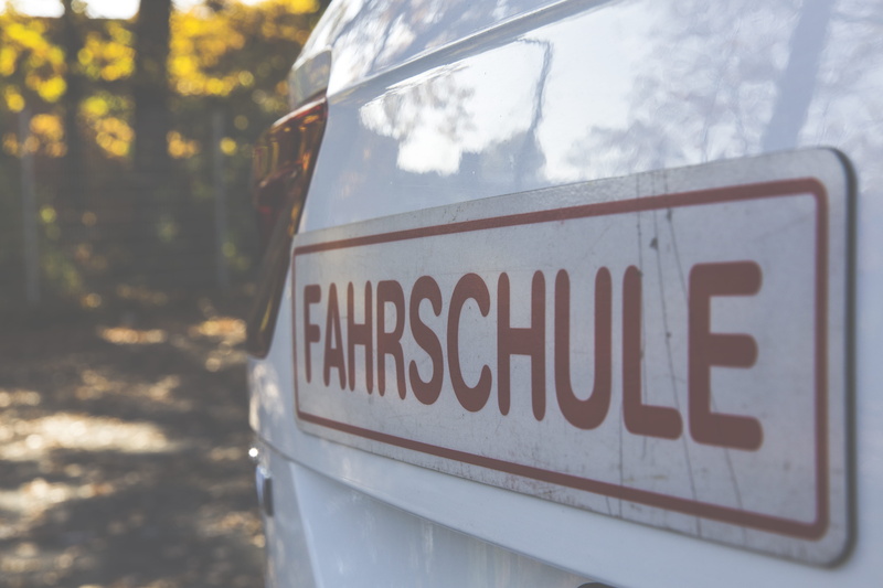 tail light, fender, symbol, information, trees, automobile, nature, text, no people, focus on foreground, car, drive, design, glass - material, vehicle
