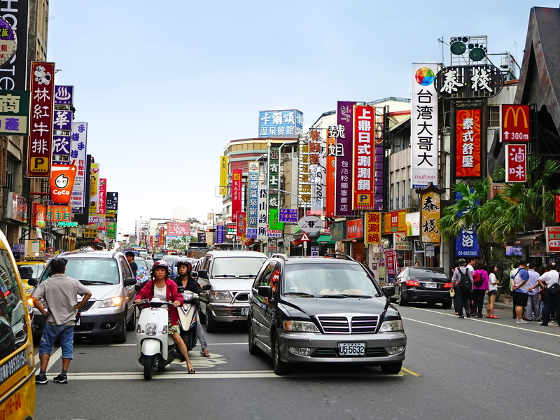 real people, vibrant, mode of transportation, vehicles, walking, men, built structure, building exterior, billboard, chinese, pedestrian, motor vehicle