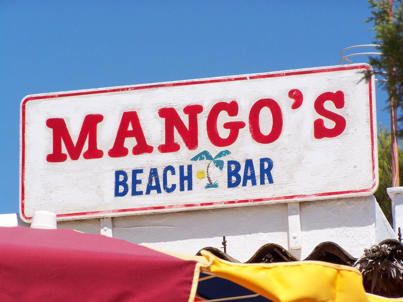 yellow, sky, holidays, signboard, red, nature, day, communication, text, vacation, road sign, safety, capital letter, business, no people, beach, clear sky